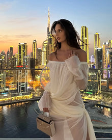 Off-shoulder draped sheer dress