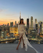 Off-shoulder draped sheer dress