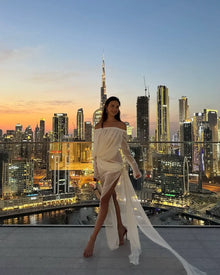 Off-shoulder draped sheer dress