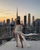 Off-shoulder draped sheer dress