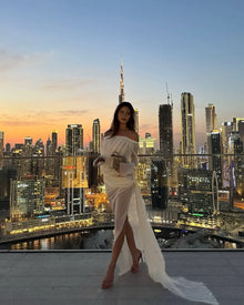 Off-shoulder draped sheer dress