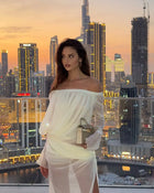 Off-shoulder draped sheer dress