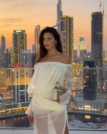 Off-shoulder draped sheer dress